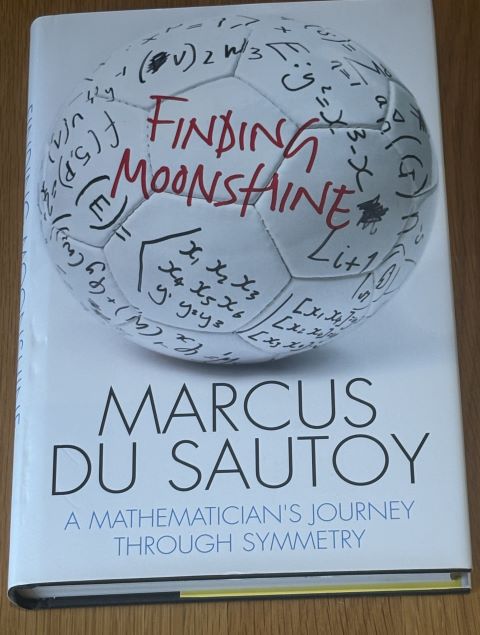 Finding Moonshine: A Mathematician's Journey Through Symmetry